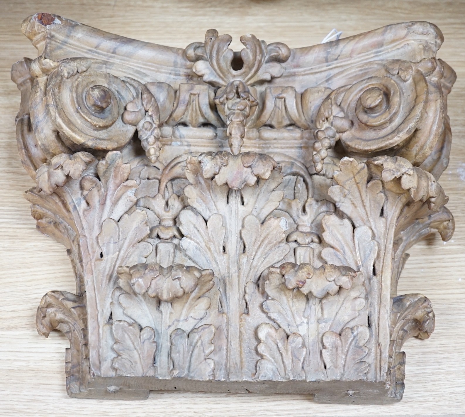 A large 19th century carved pine and gilt-gesso Corinthian capital, 33cms high x 41cm wide (at the top)